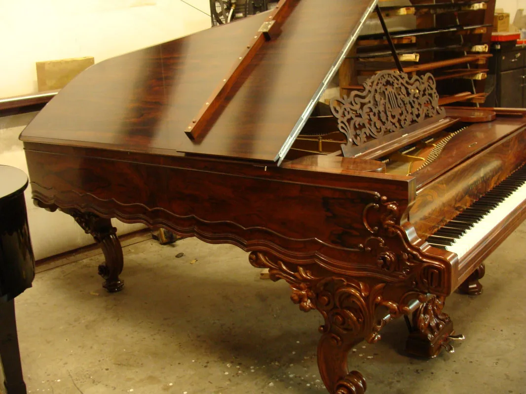 Antique carved rosewood grand piano
