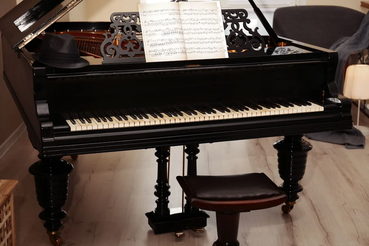 Black grand piano with an ornate music desk