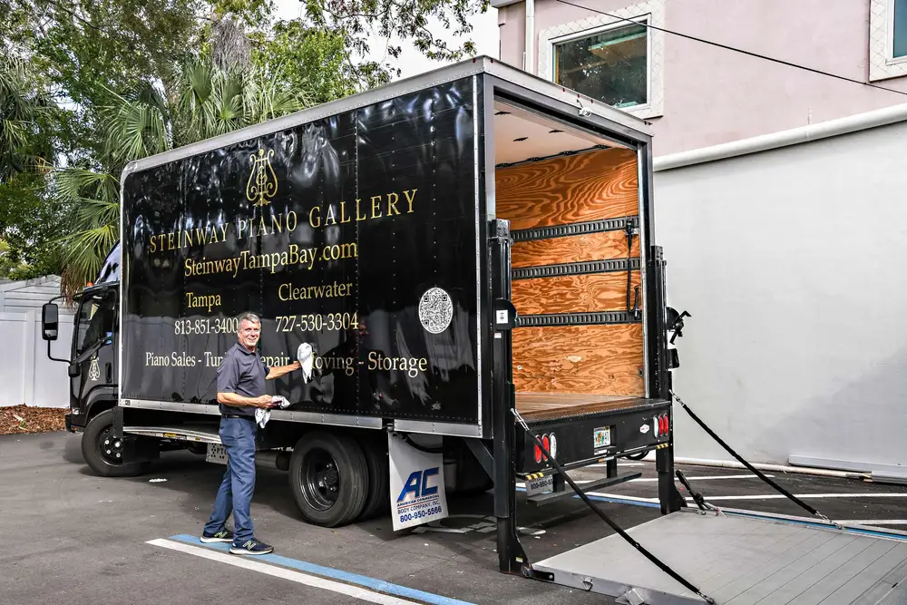 Piano moving truck with its liftgate lowered